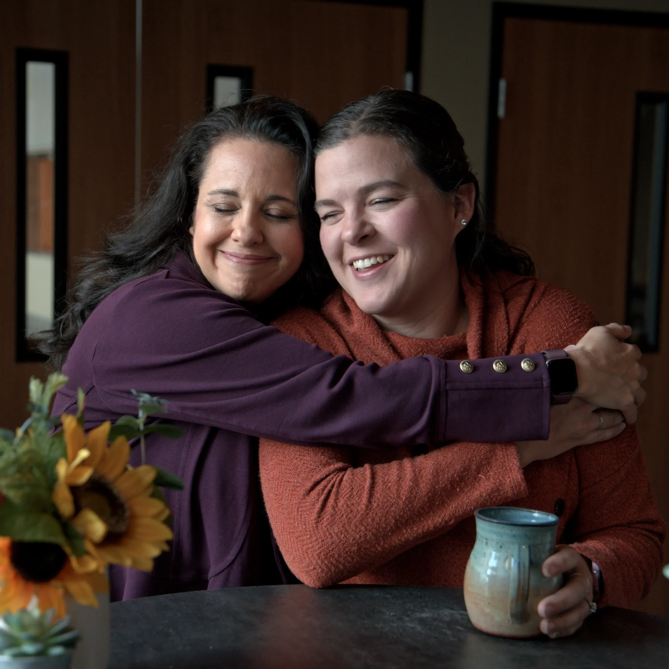 Melisa Berry hugging woman